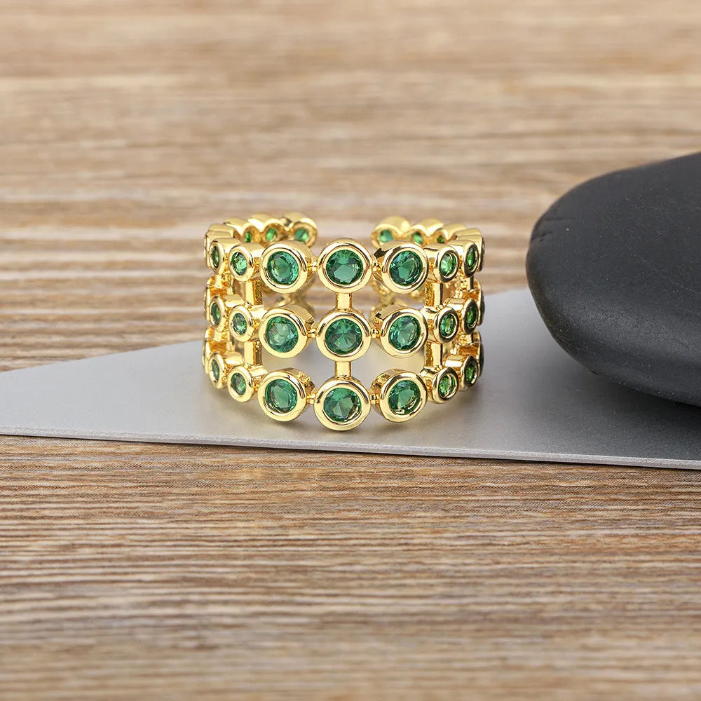 Copper 18K real gold plated wide band ring with green zircon centrepiece.