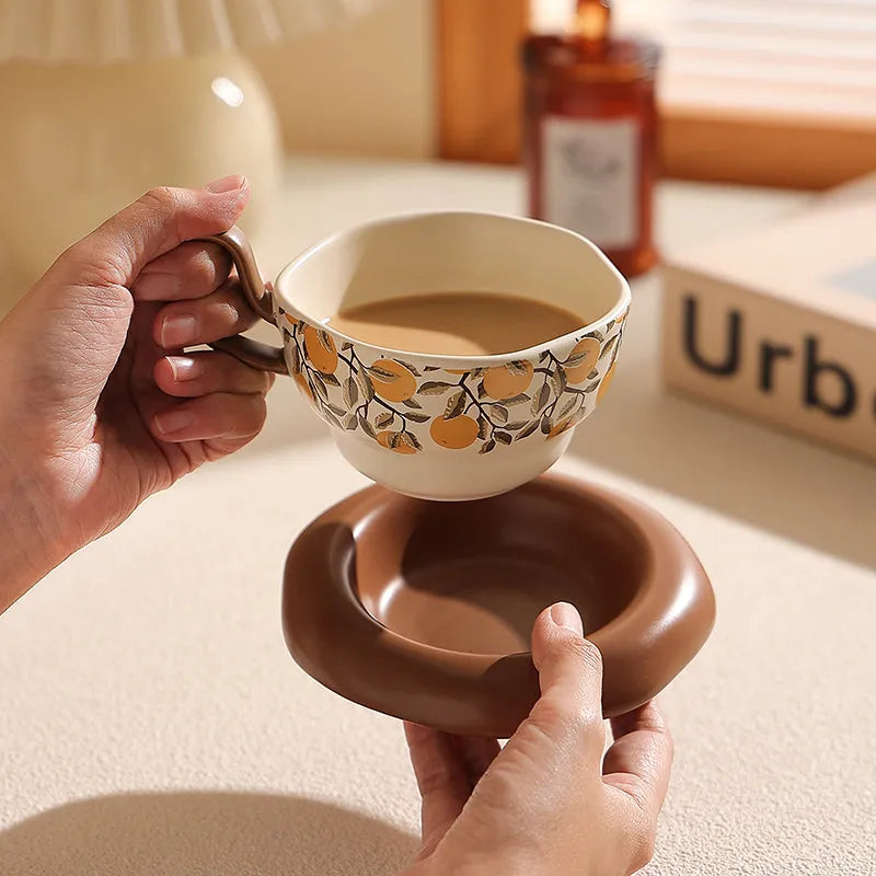 Antique style ceramic coffee cup and saucer set with medieval pattern, 210ml capacity, in black or orange.