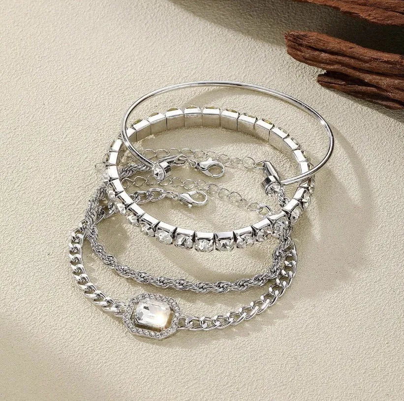Women's four-piece alloy bracelet set with geometric shapes and chain links in gold or silver finish