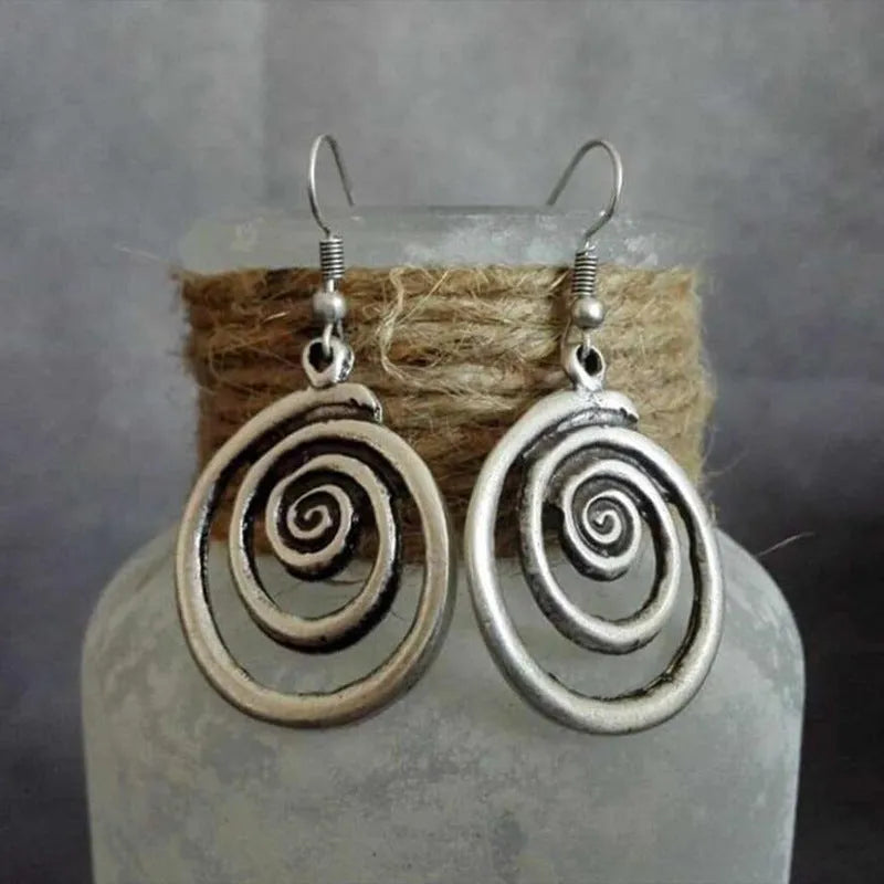 Silver geometric spiral distressed earrings with a retro national style design.
