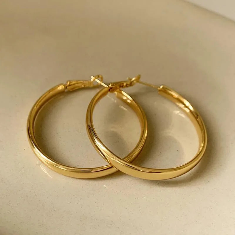 Gold and silver metal circle hoop earrings with 40mm diameter measurement