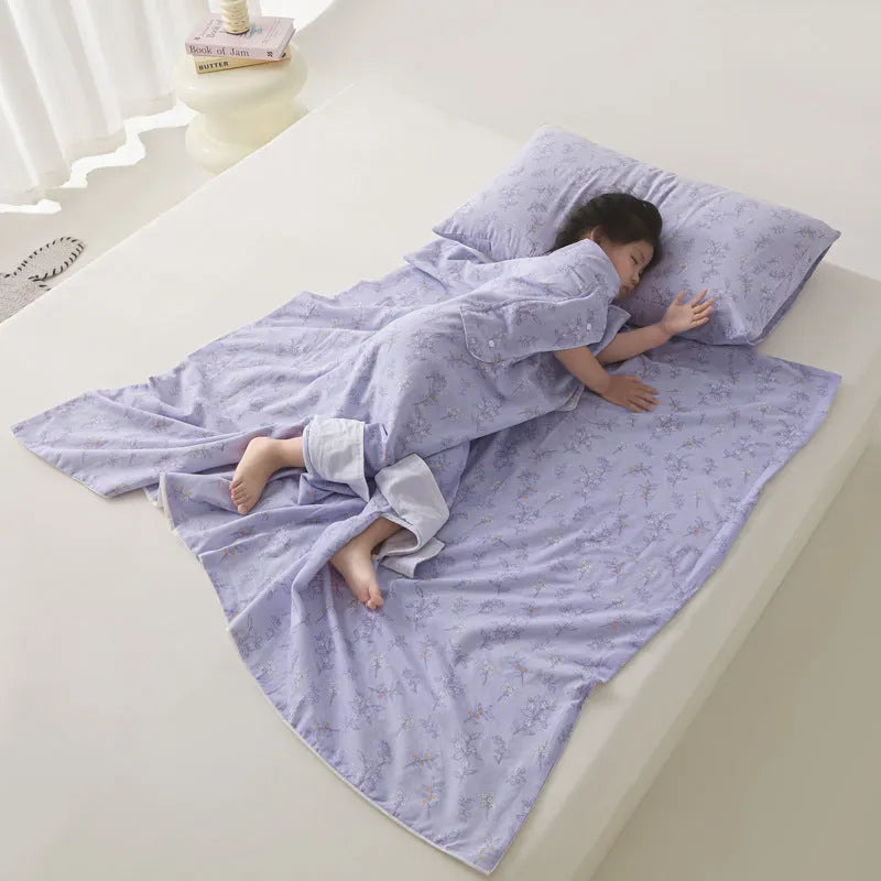 Anti-kick sleeping bag blanket in a choice of colours and sizes on a bed.