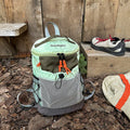 Blue casual waterproof nylon backpack with curved straps and fold design.