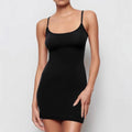 A black sleeveless sling dress with a sheath silhouette and short skirt.
