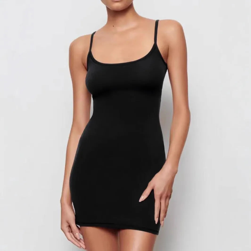 A black sleeveless sling dress with a sheath silhouette and short skirt.