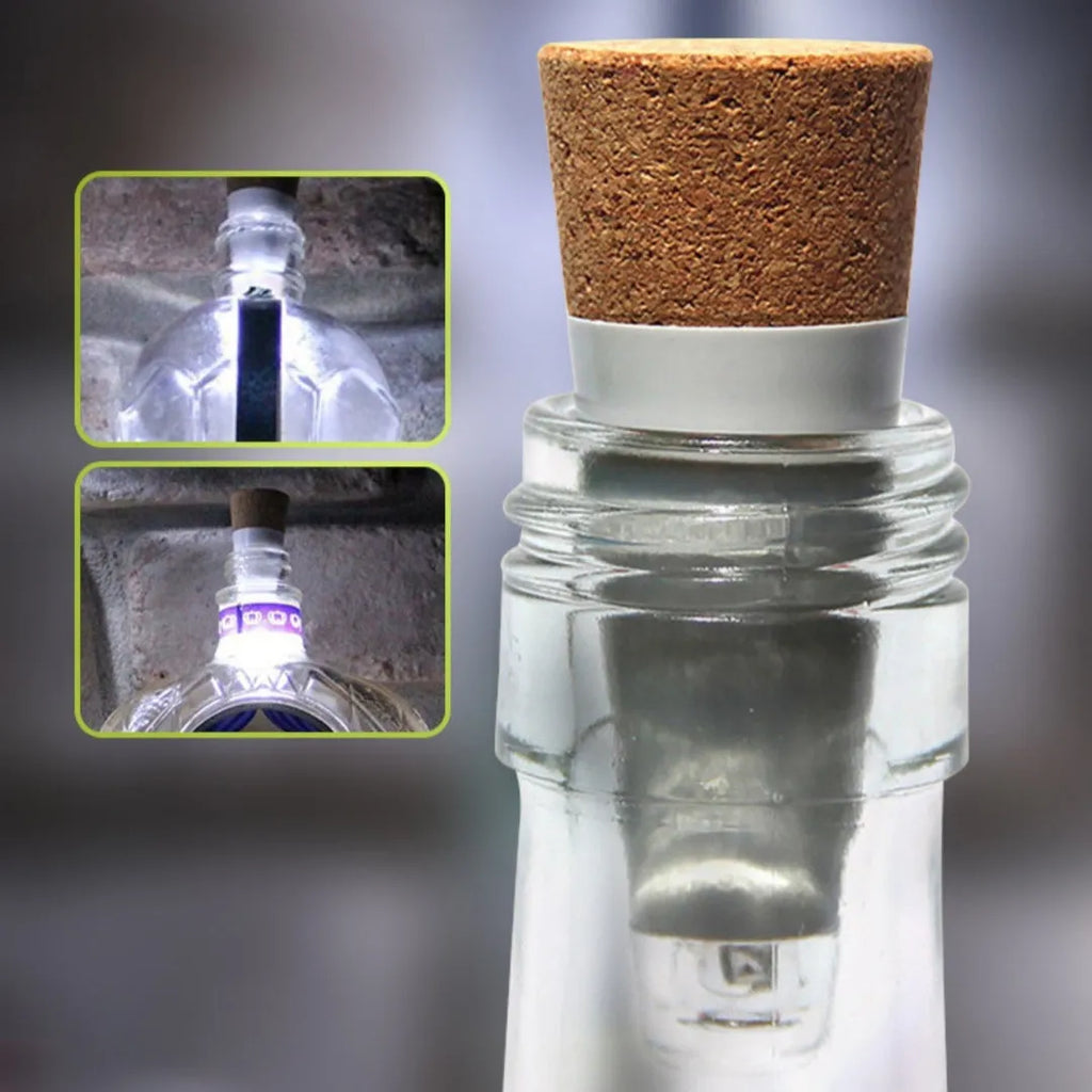 White plastic USB-rechargeable LED bottle cap cork light with micro-USB port, shown next to a whisky bottle.