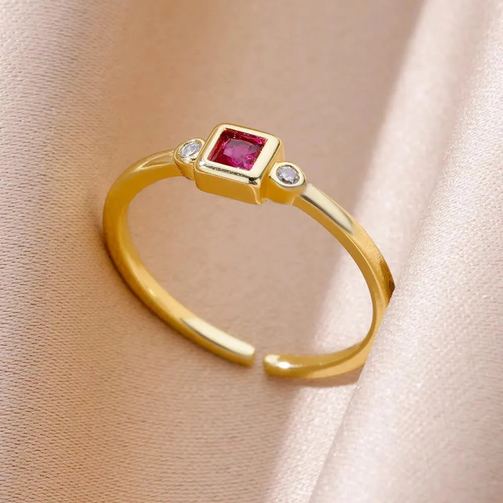 18K gold plated copper open mouth ring with synthetic zircon love emerald motif on white background