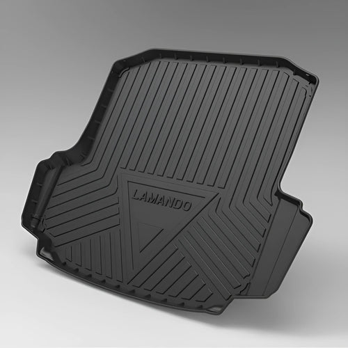 Black carbon fibre pattern TPE car trunk protector mat lying flat.