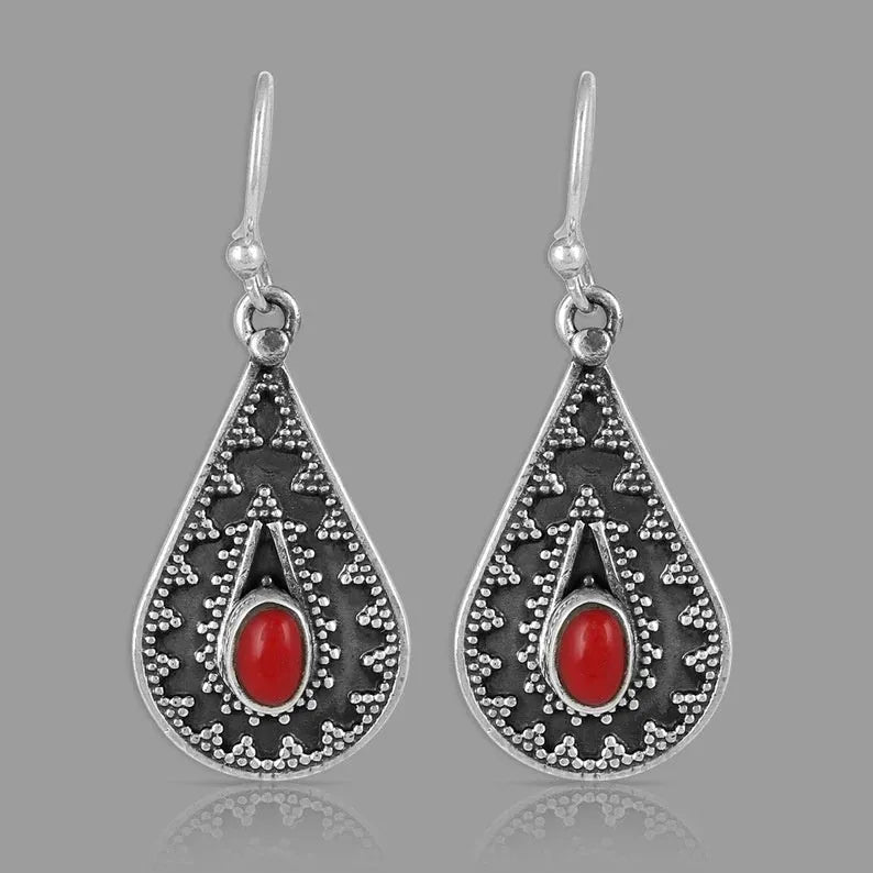 Silver drop-shaped retro earrings for women with European and American national style design.