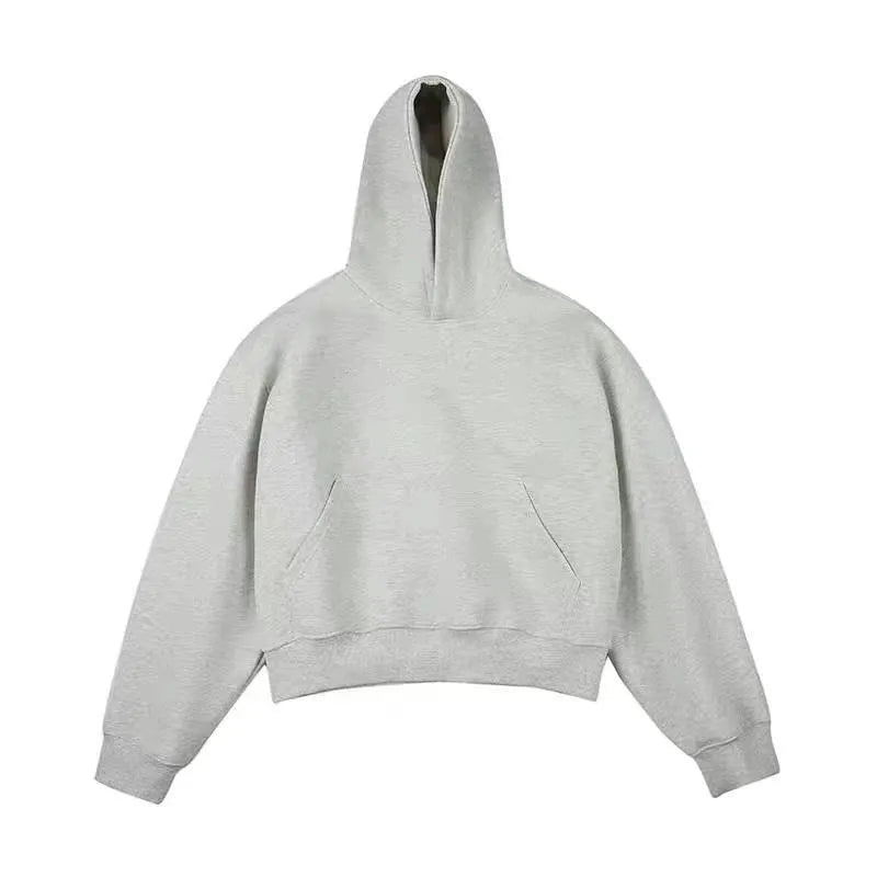 Man wearing a dark grey Chinese cotton composite hooded sweater with a removable hood in street fashion style.