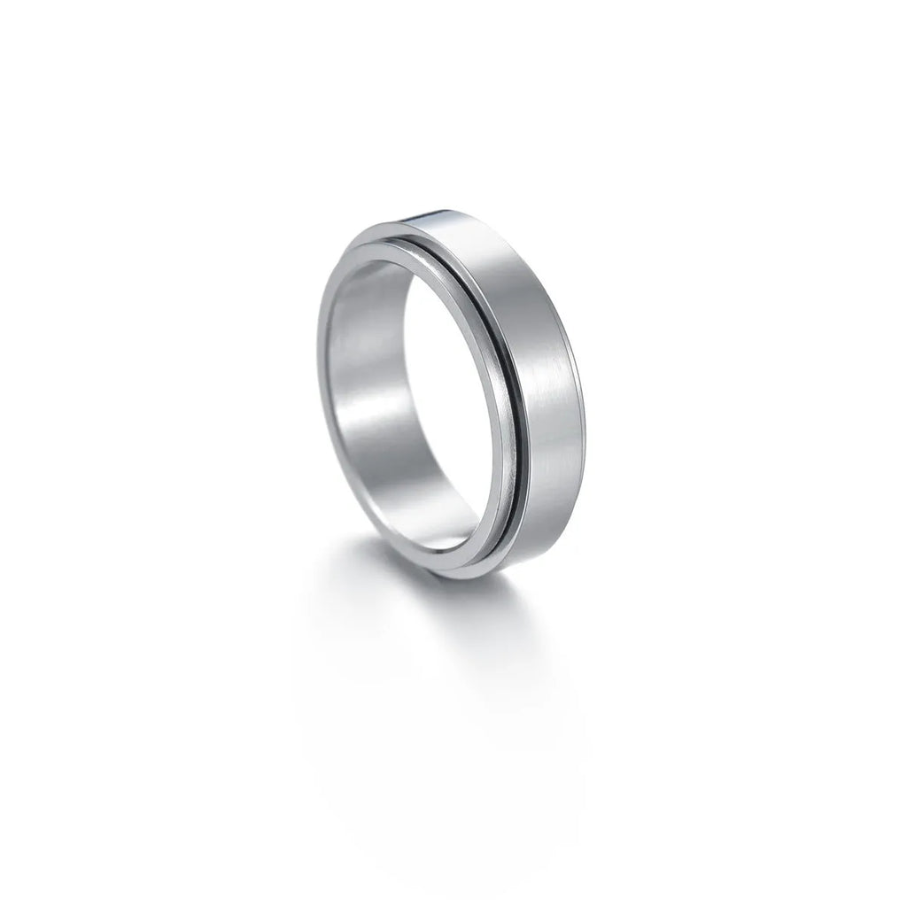 Titanium steel star moon ring in glossy finish on a neutral background, showing celestial motif and band width