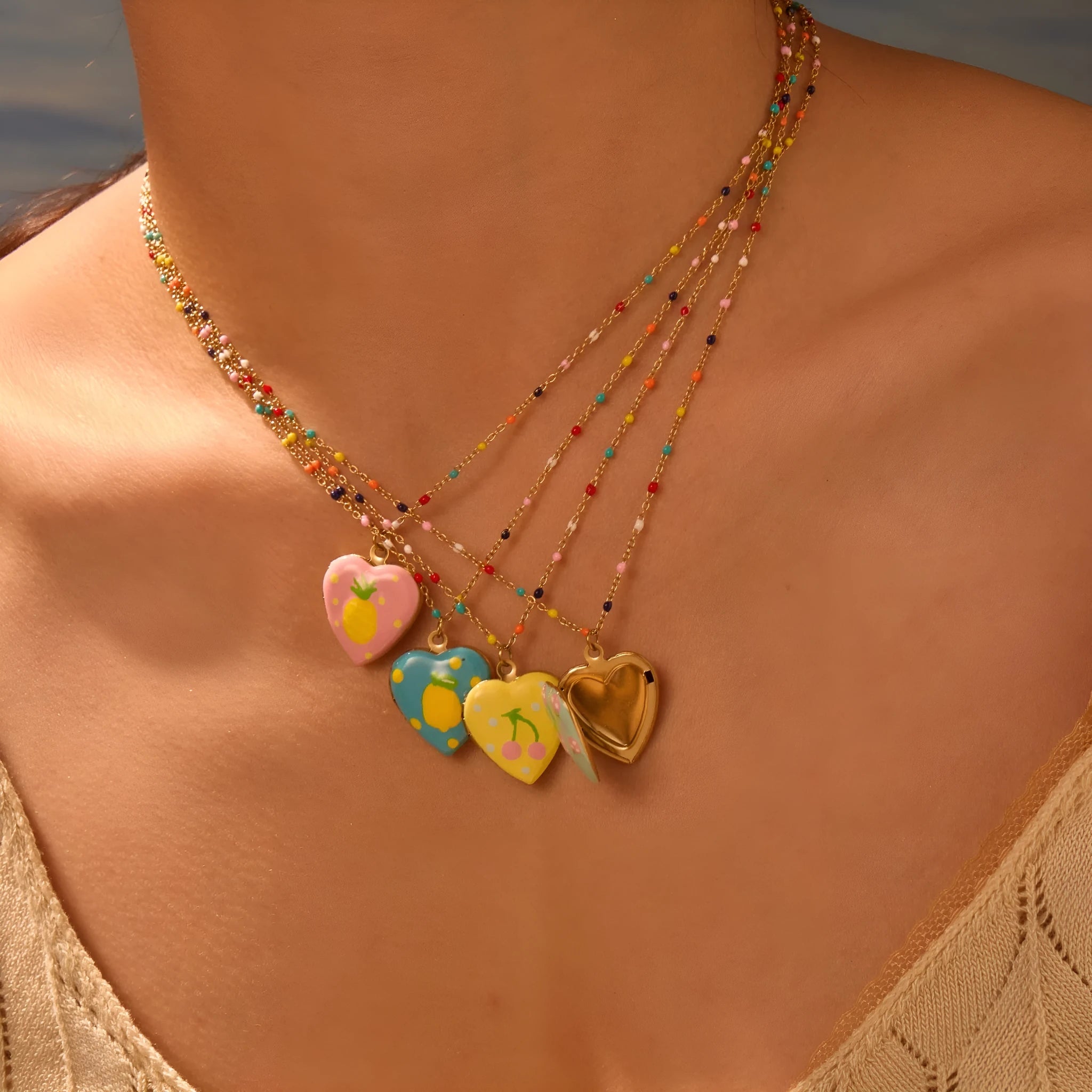 Gold-plated stainless steel necklace with a detailed strawberry-shaped pendant on a chain.