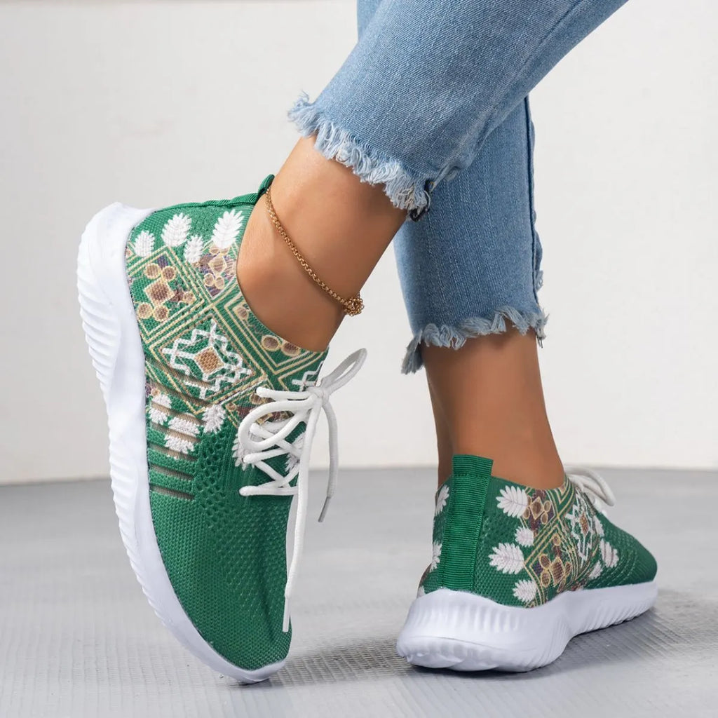 Women's woven flat casual sneakers in green with mesh upper, round toe, front lace-up, and rubber sole