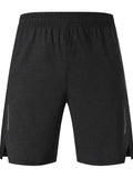 Man wearing forest green stretch spandex shorts, showing mid-waist fit and casual short length.