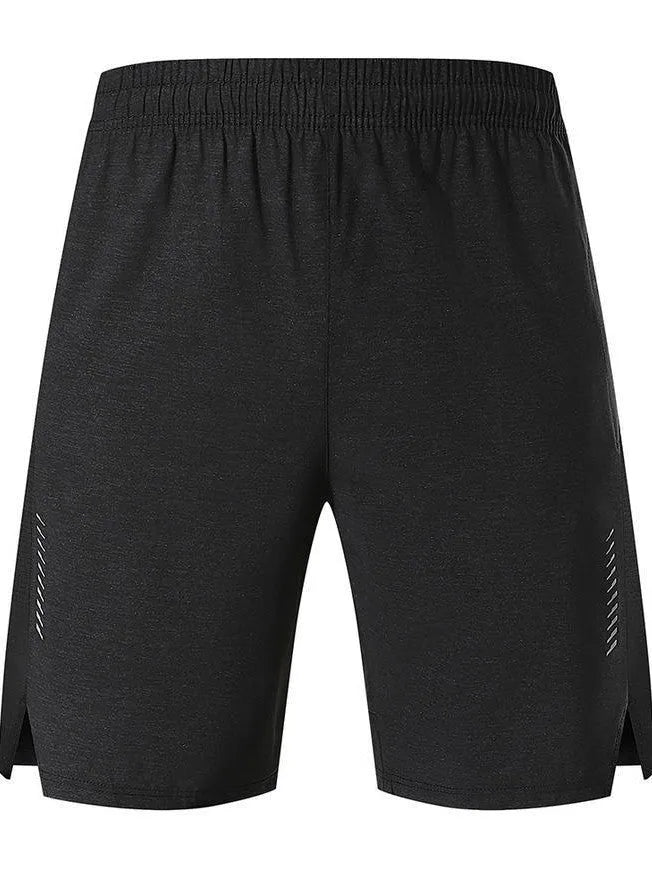 Man wearing forest green stretch spandex shorts, showing mid-waist fit and casual short length.