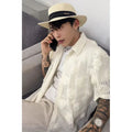 Men's loose fit short-sleeved shirt with a heavy industry floral print in milky white.