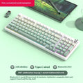 98-key wireless Bluetooth mechanical keyboard kit with metal knob on desk
