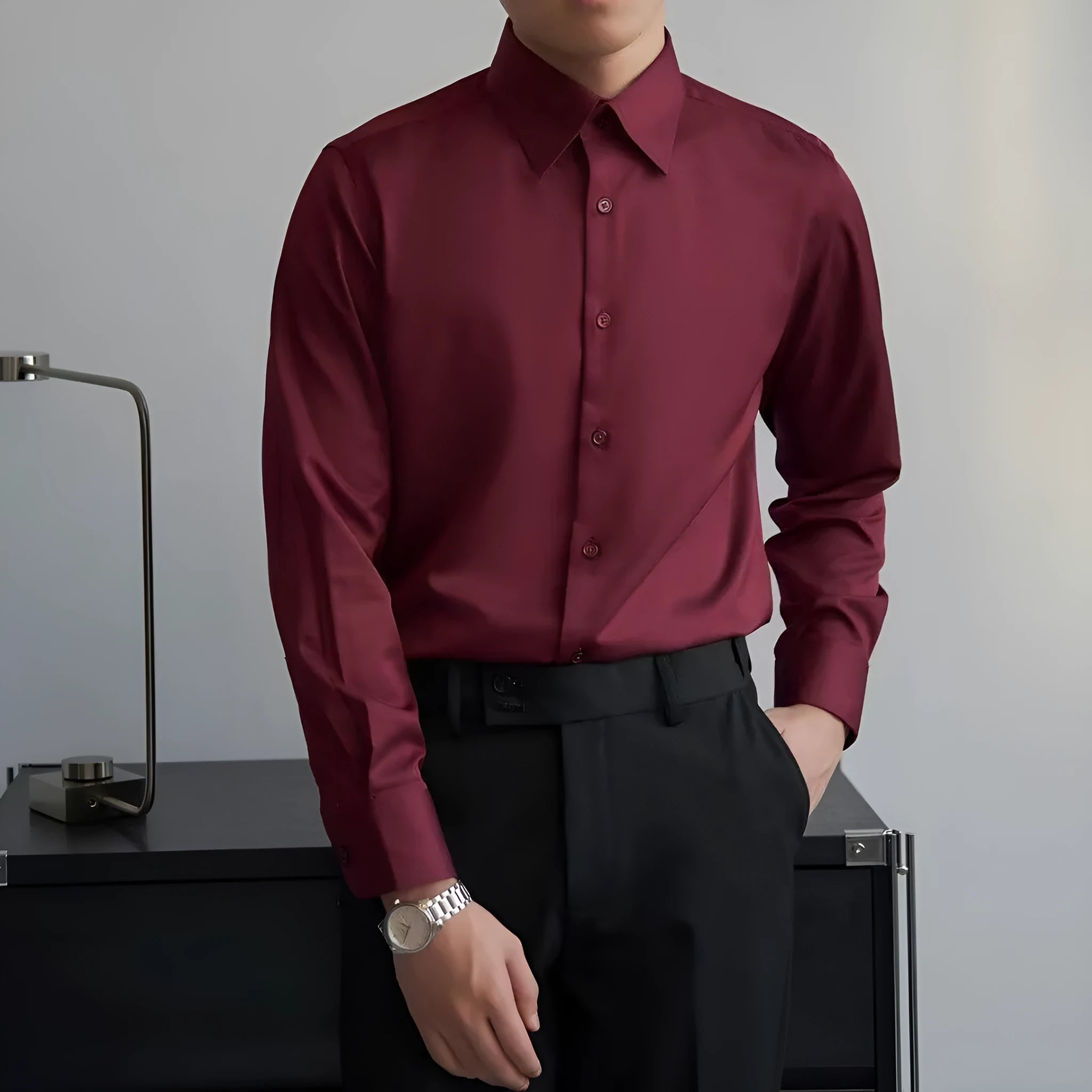 Man wearing a black Japanese retro style loose fit cardigan shirt with long sleeves.