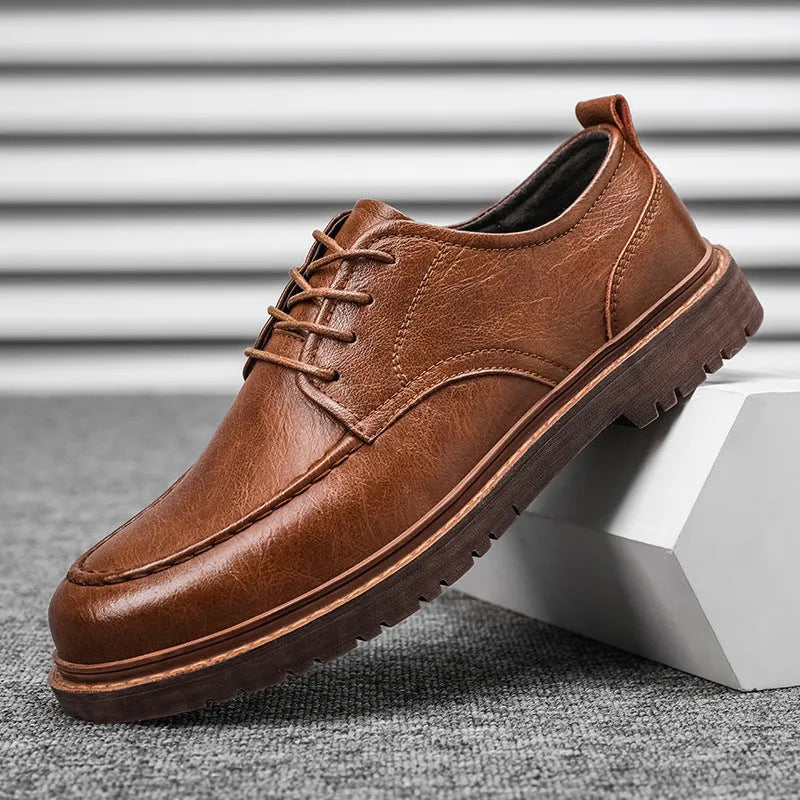 Casual round-toe leather shoes in brown with a flat rubber sole and sewing line details
