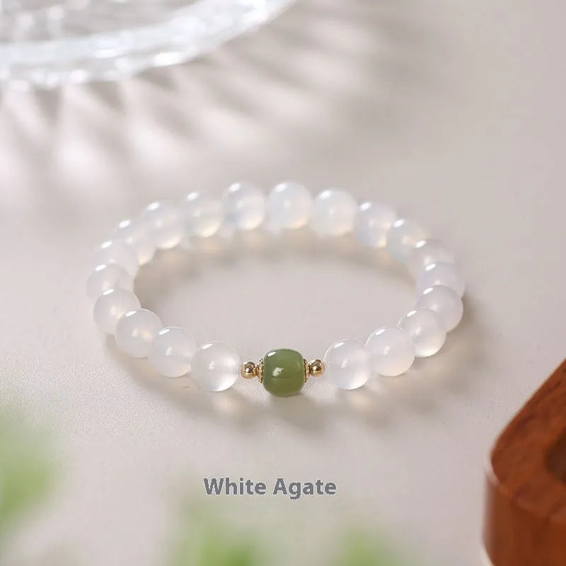 Handmade natural white agate crystal bracelet with cinnabar inlay details in 6mm and 8mm sizes