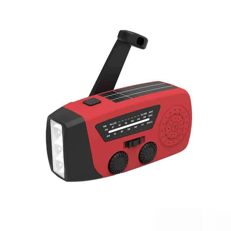 Red rechargeable emergency hand radio with built-in torch and wrist strap for disaster preparedness kits