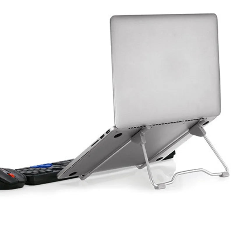 Grey aluminium alloy and plastic adjustable stand holding a mobile phone on a desk.