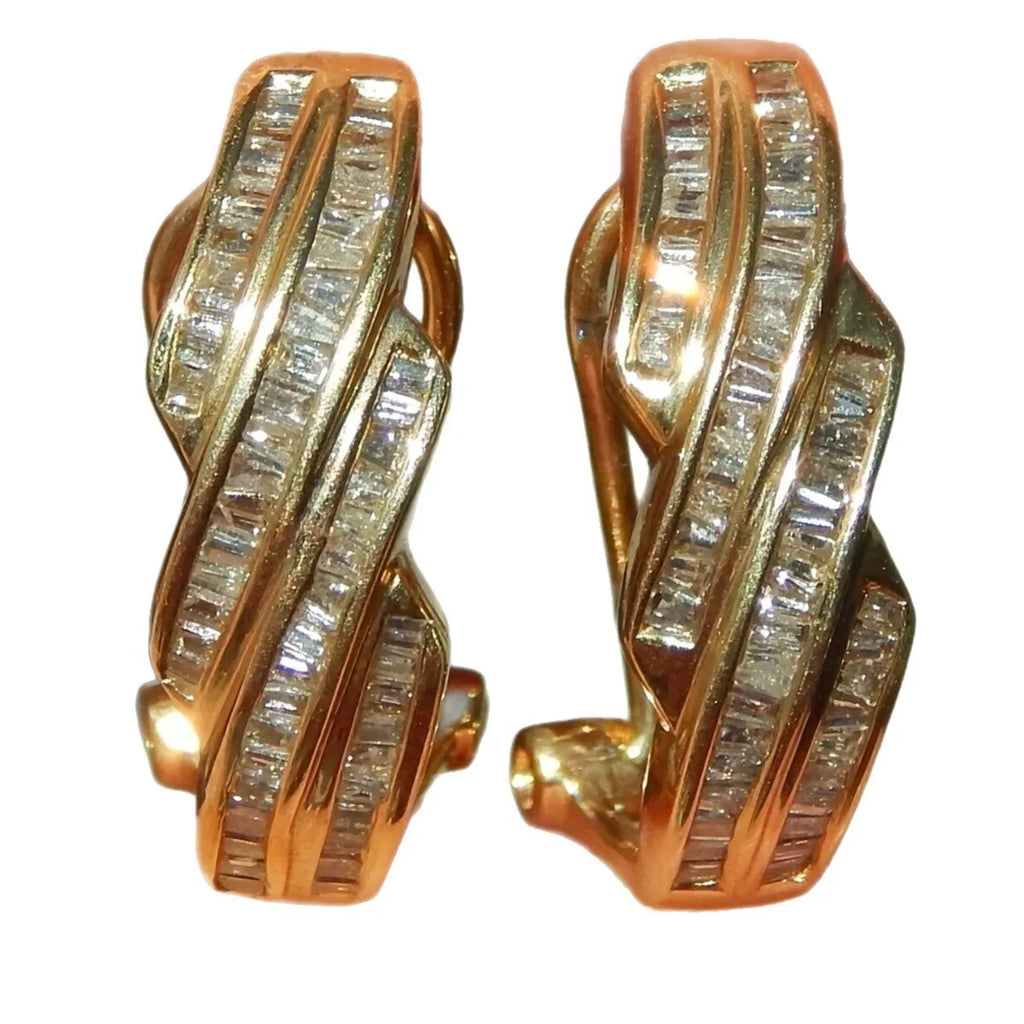 A pair of gold geometric earrings with a round design made from copper.
