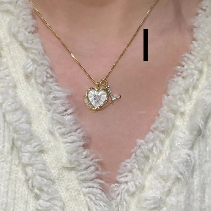 Women's pendant necklace with titanium steel chain and natural mother-of-pearl in heart-shaped design