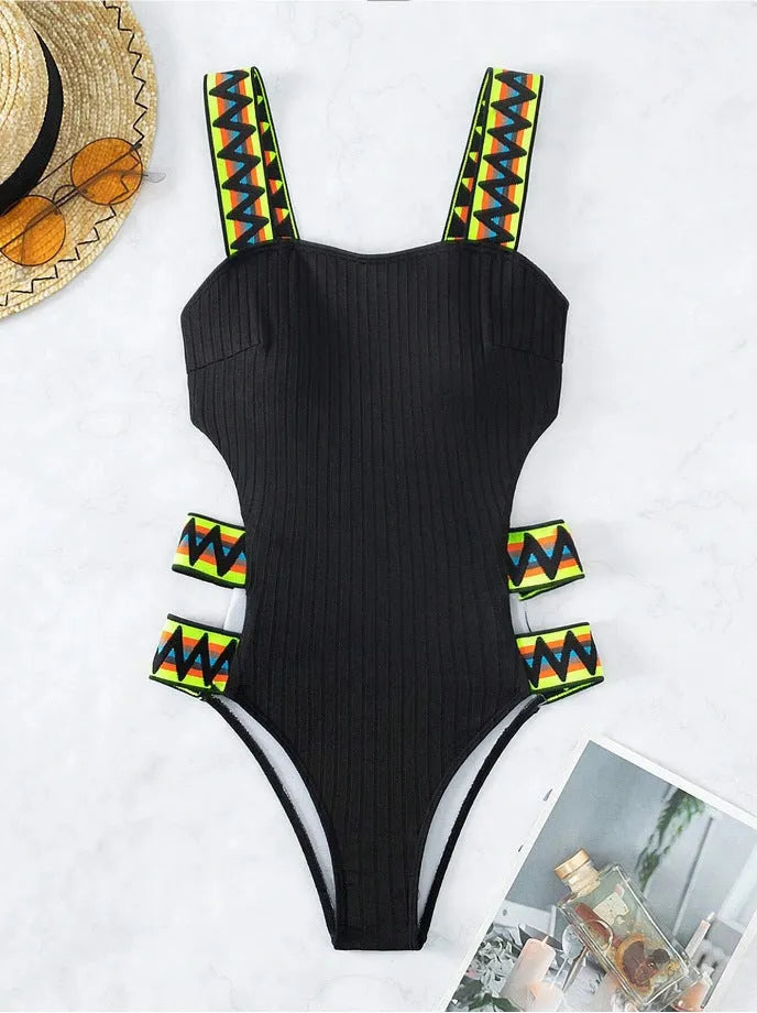 Black solid colour one-piece swimsuit for women on a mannequin, showing full torso coverage and classic swimsuit design.
