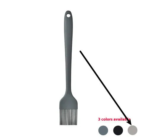 Black silicone kitchen utensil set with 12 tools stored in a rotating plastic storage bucket on a worktop.