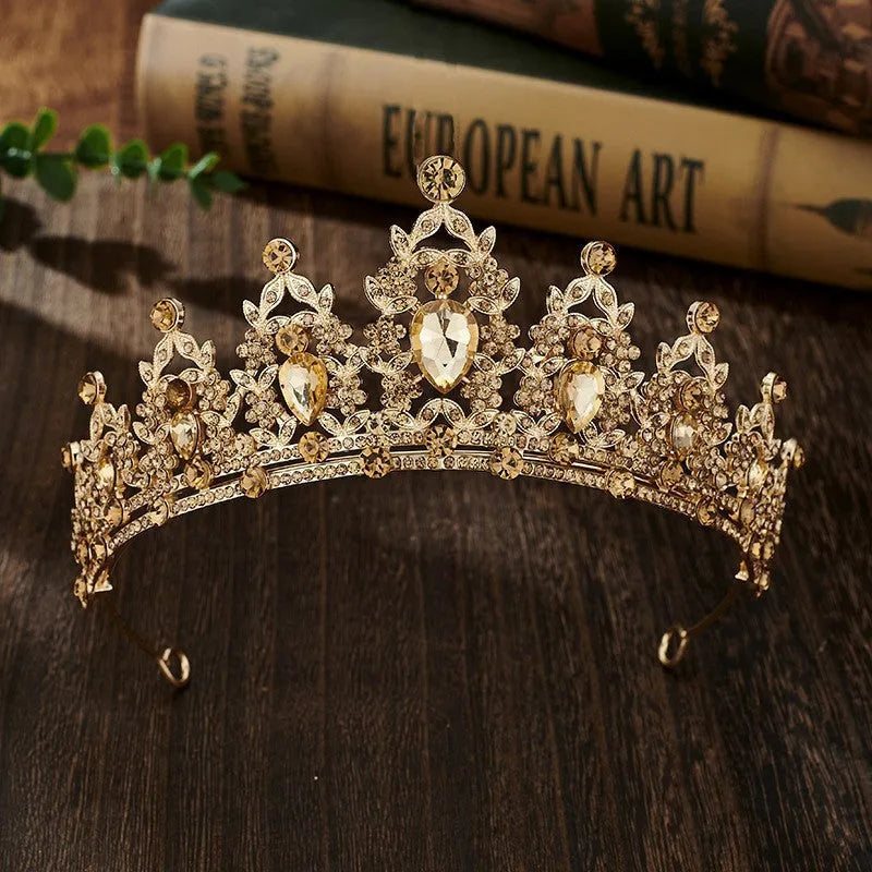 Gold alloy crown-shaped wedding hair headdress with electroplated finish on neutral background