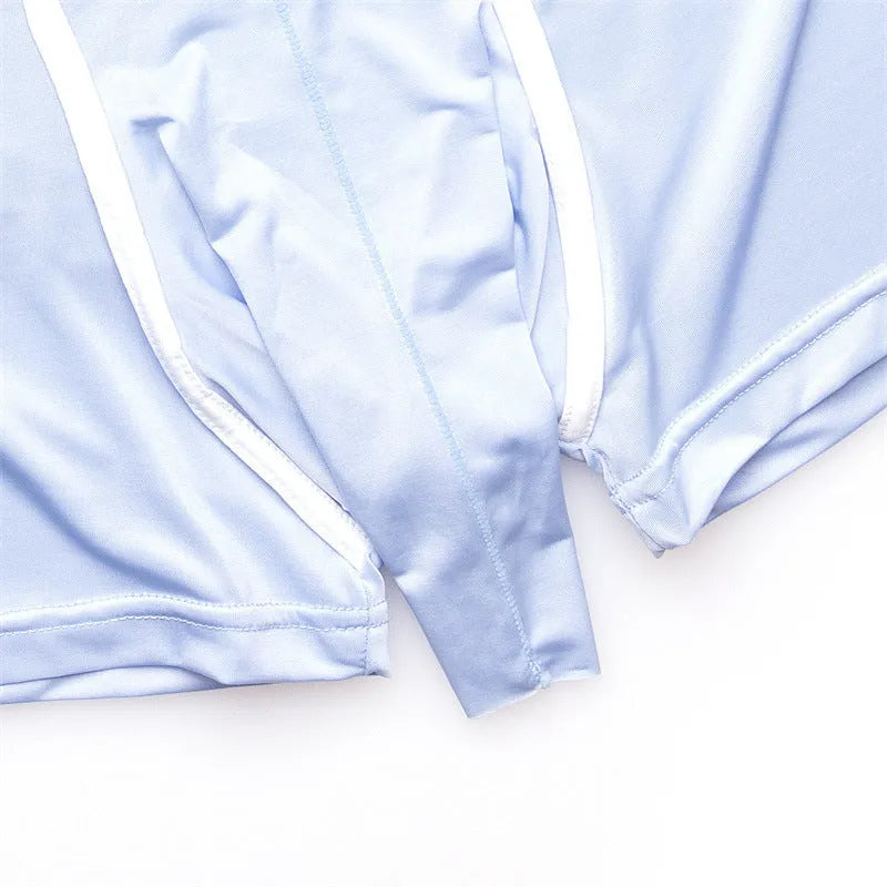 Men's solid colour ice silk boxer shorts on a grey background, showing the mid waist design and lightweight fabric texture.