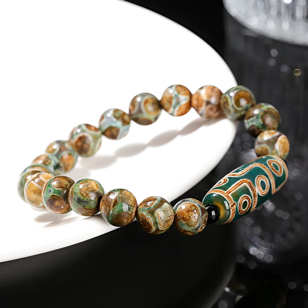 Handmade dzi bead bracelet with 8mm barrel beads in green, unisex geometric design.