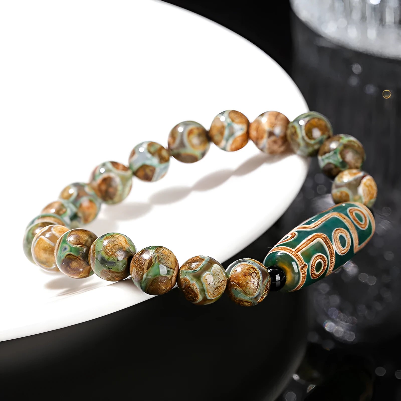 Handmade dzi bead bracelet with 8mm barrel beads in green, unisex geometric design.