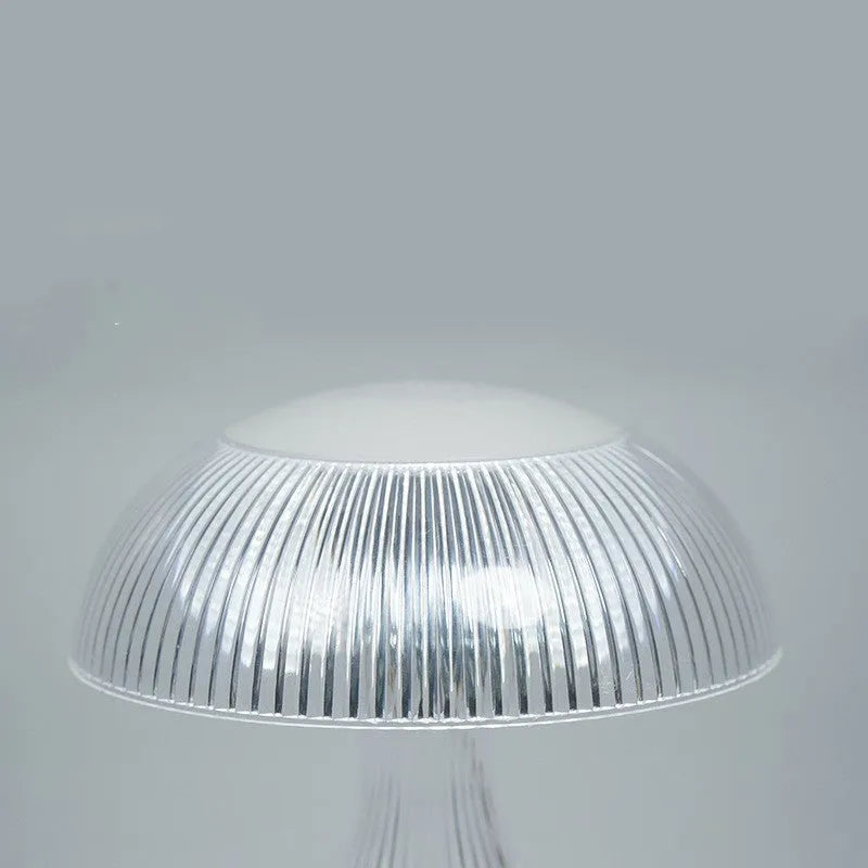 White touch control USB rechargeable night lamp with acrylic light body on a table.