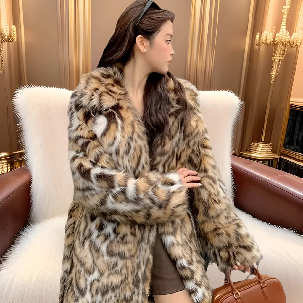 Long faux fur coat with a textured fox fur collar and side pockets.