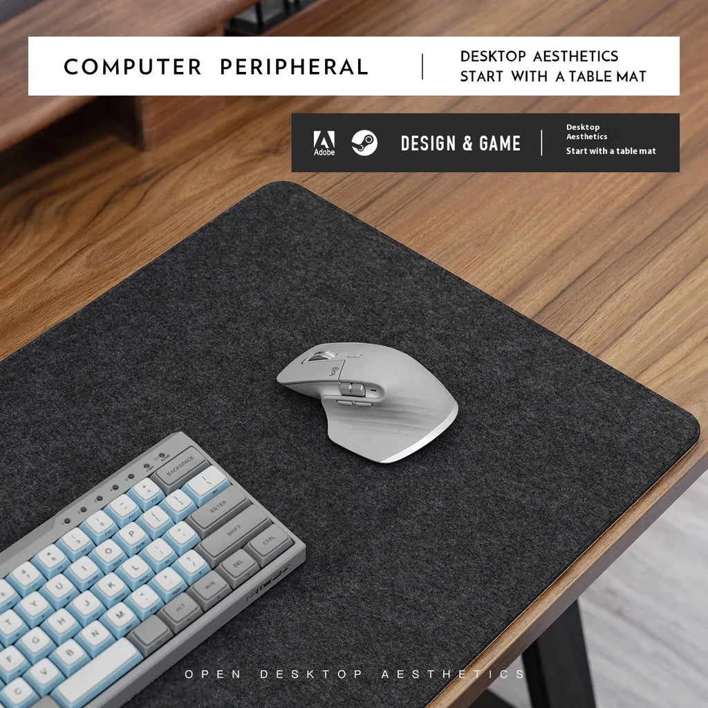 Oversized felt cork desk mat in black and grey pattern on a wooden desk