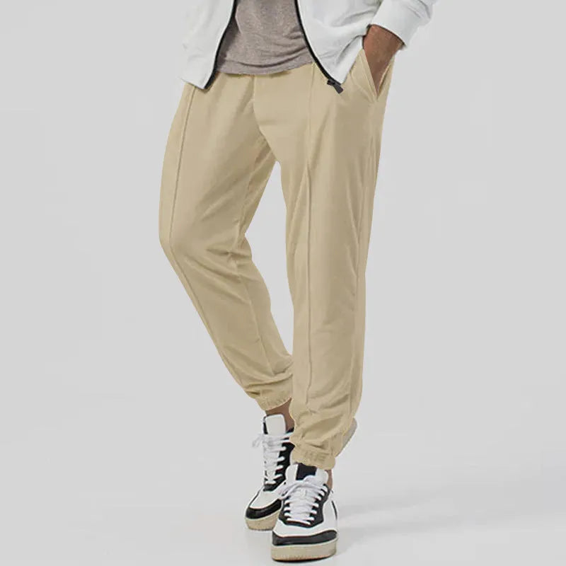 Men's grey cotton blend straight-leg track sweatpants with a tapered fit and elasticated waist.