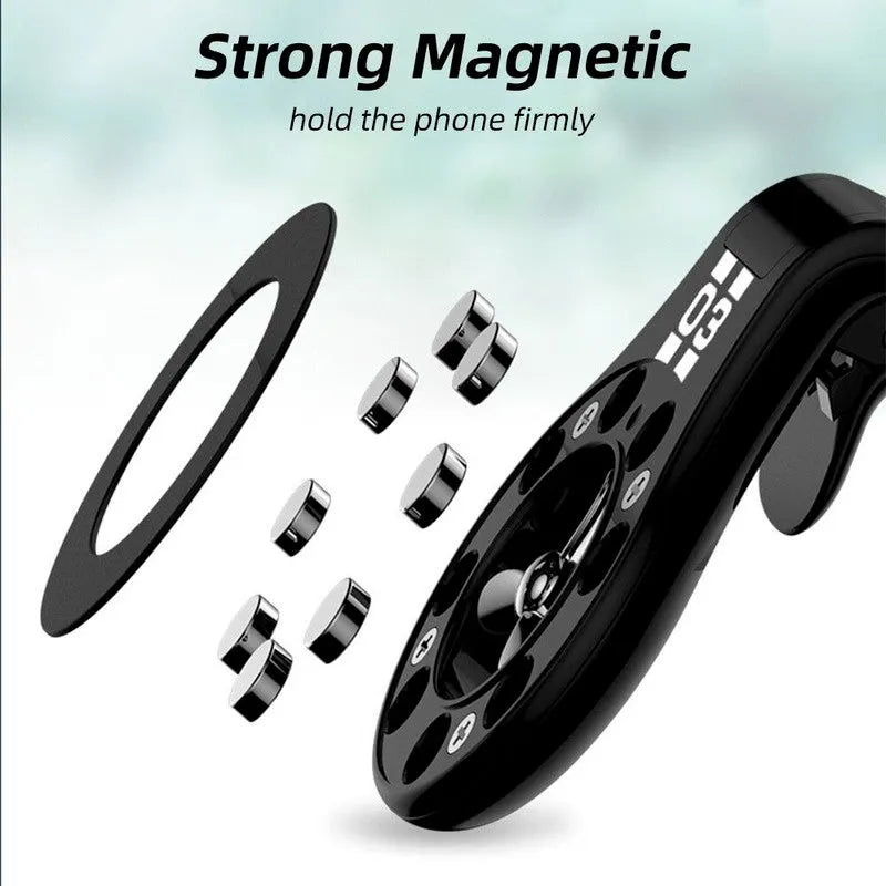 Black magnetic car phone holder clipped to a car air vent, showing a smartphone attached and the 360-degree rotating bracket.