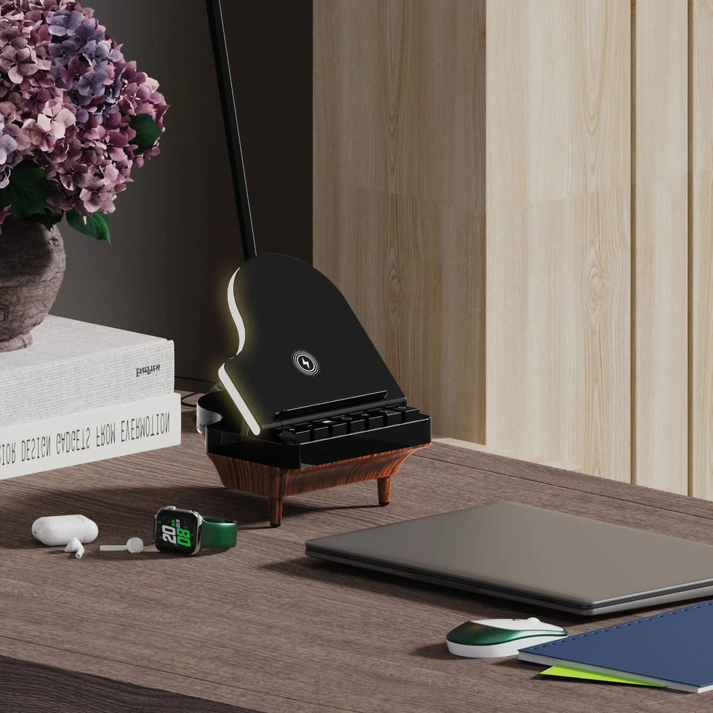 Black multi-function Bluetooth speaker wireless charger and phone holder on a desk