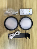 Black magnetic LED painting lamp with remote control on wooden surface