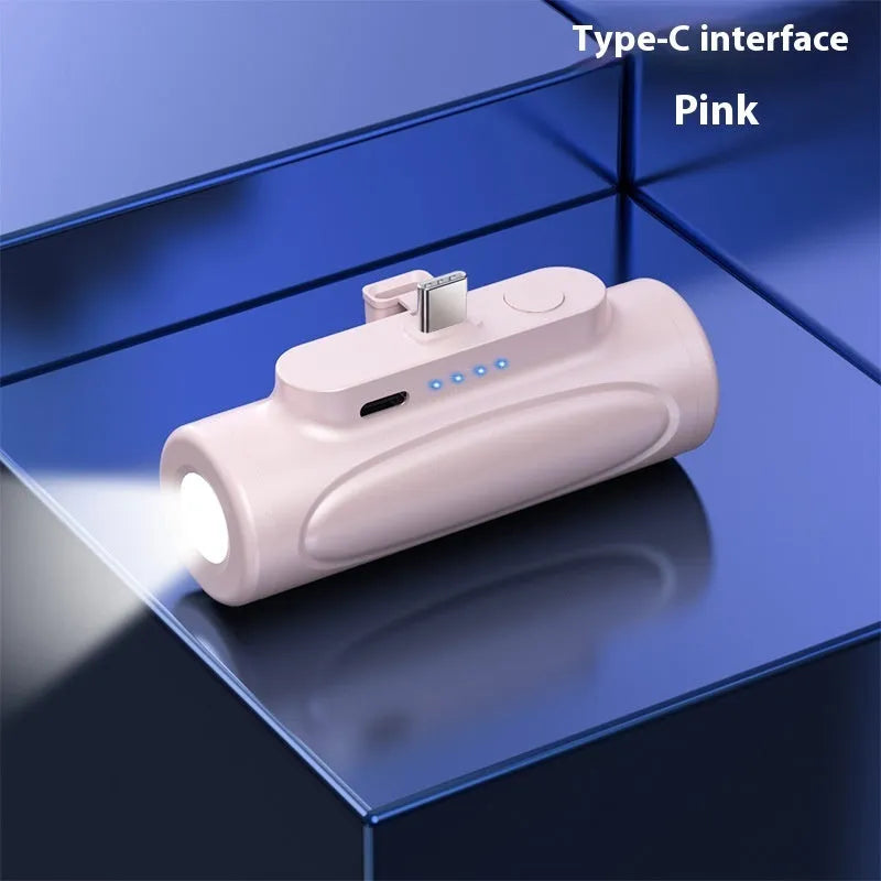 Black creative power bank with integrated LED flashlight, showing USB-C port, dimensions 83x27x41mm.