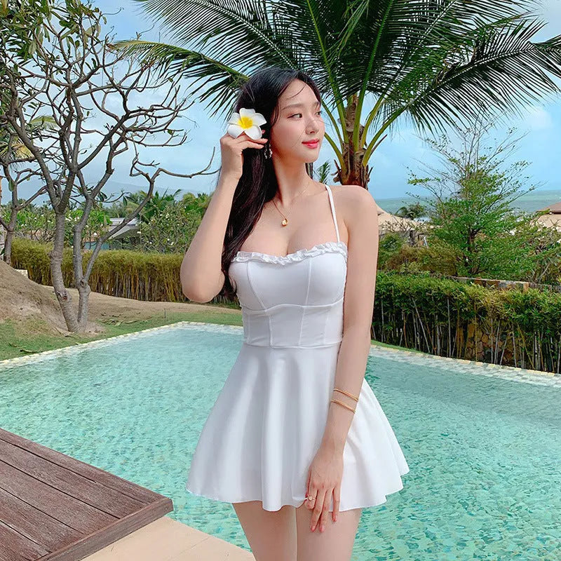 White women's one-piece swimsuit with hollow out detailing and solid colour design