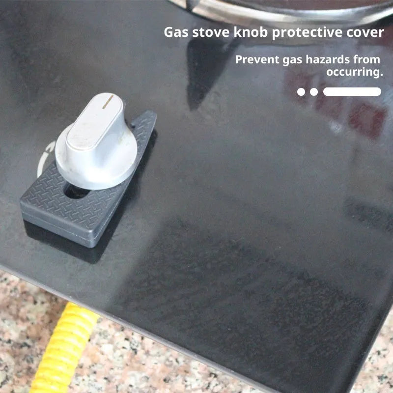 Gray plastic gas stove knob safety lock clipped onto a gas cooker knob showing side profile