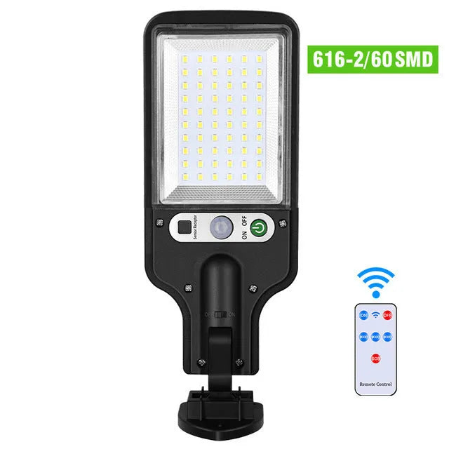 Outdoor solar LED wall lamp 28LED variant mounted on a garden fence for patio lighting