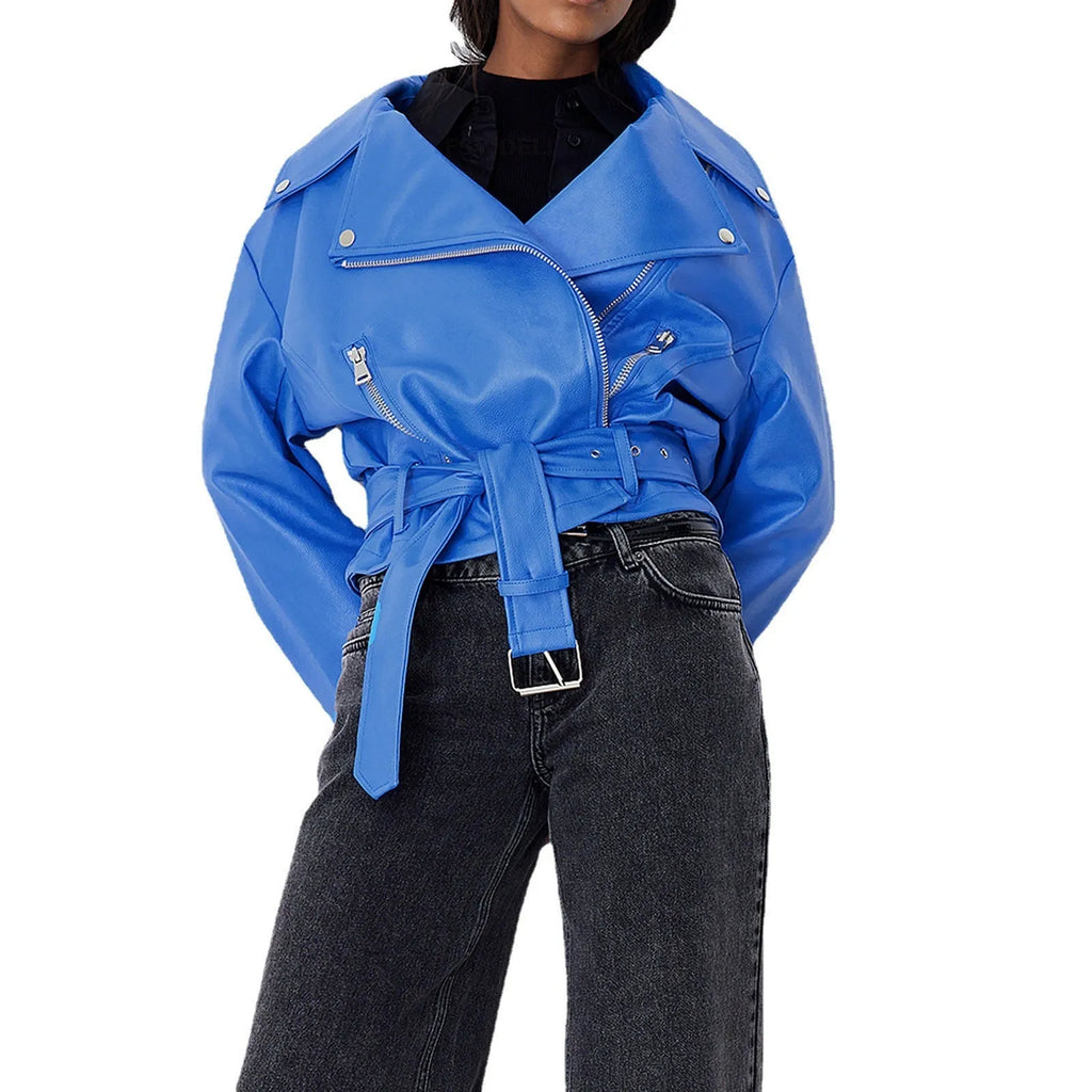 Black punk-style short jacket with a Peter Pan collar, lapel, and waist belt on a hanger.