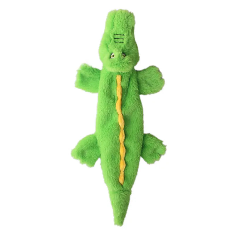 Green crocodile plush dog toy with squeaker and crinkle paper tail on a white background.