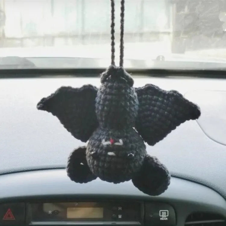 Plush hand-woven car hanging ornament in a cartoon design, made from soft polyester fabric.