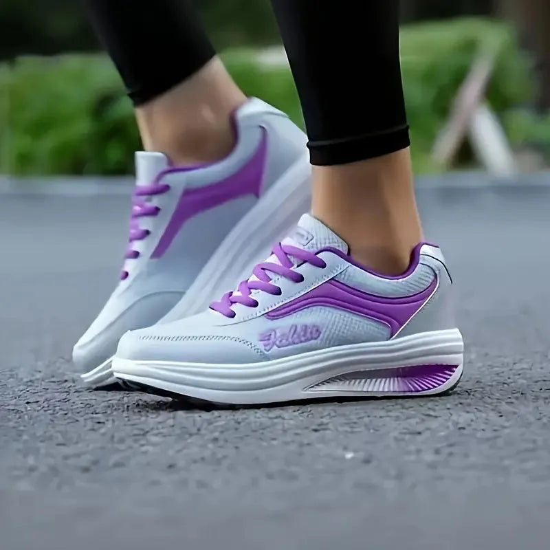 Women's heelless sports travel shoes in grey powder colour with a medium heel.