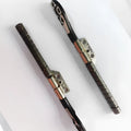 MacBook Pro 15-inch A1286 laptop screen hinge shaft replacement part on foam packaging.